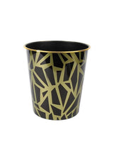 Black trash can with gold geometric pattern and gold rim