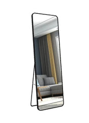 Huitich sleek full length floor mirror UAE with black frame standing in modern living room