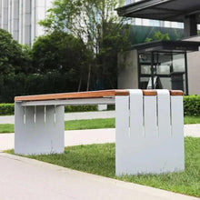 Outdoor bench with wood slat seat and white frame, corner view