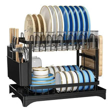 Black dish drainer rack with blue and white plates, utensil holders, and draining tray