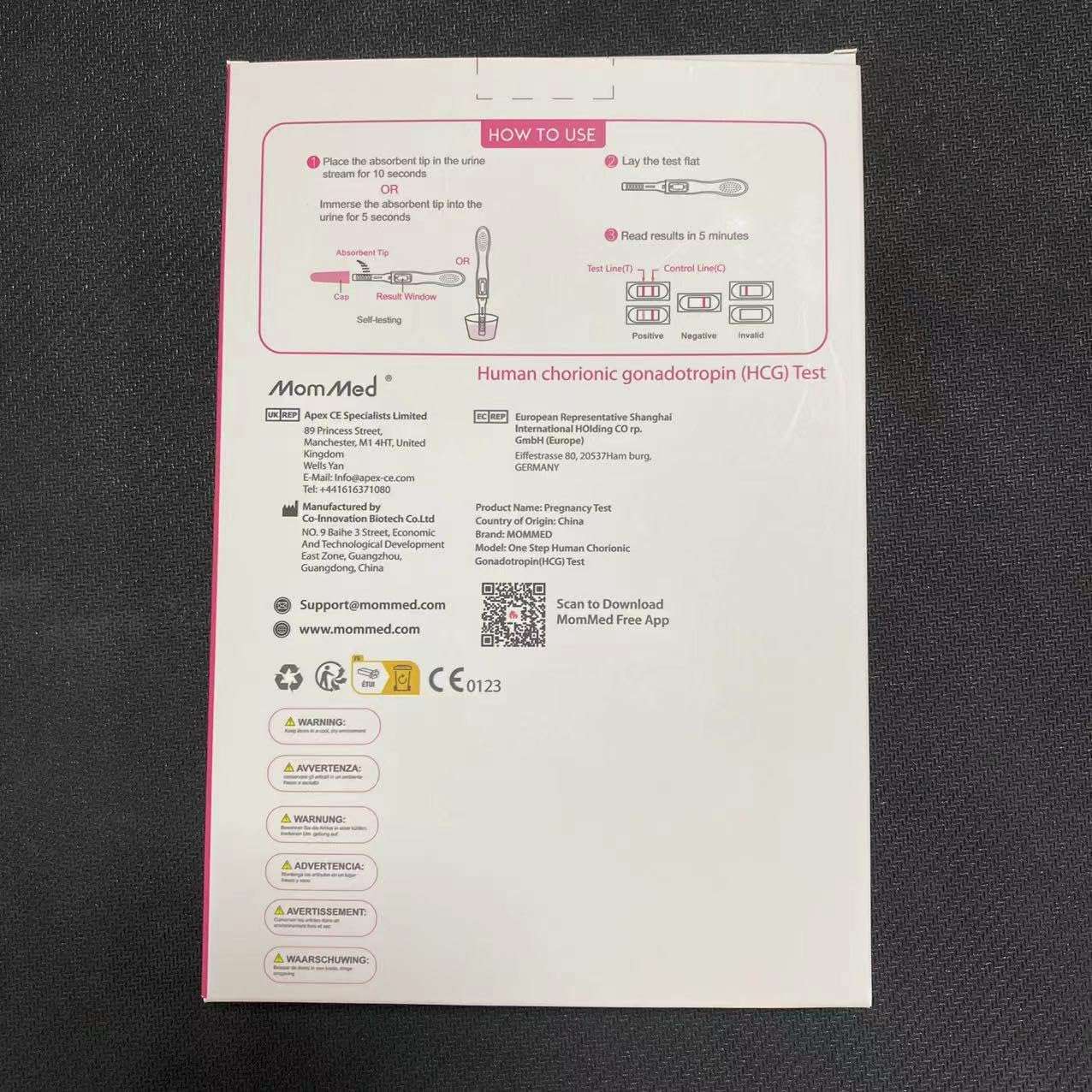 Back of MOMMED HCG midstream pregnancy test box with instructions diagrams icons and warnings