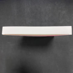 Top view of MOMMED HCG midstream pregnancy test white box on black background showing sealed retail packaging