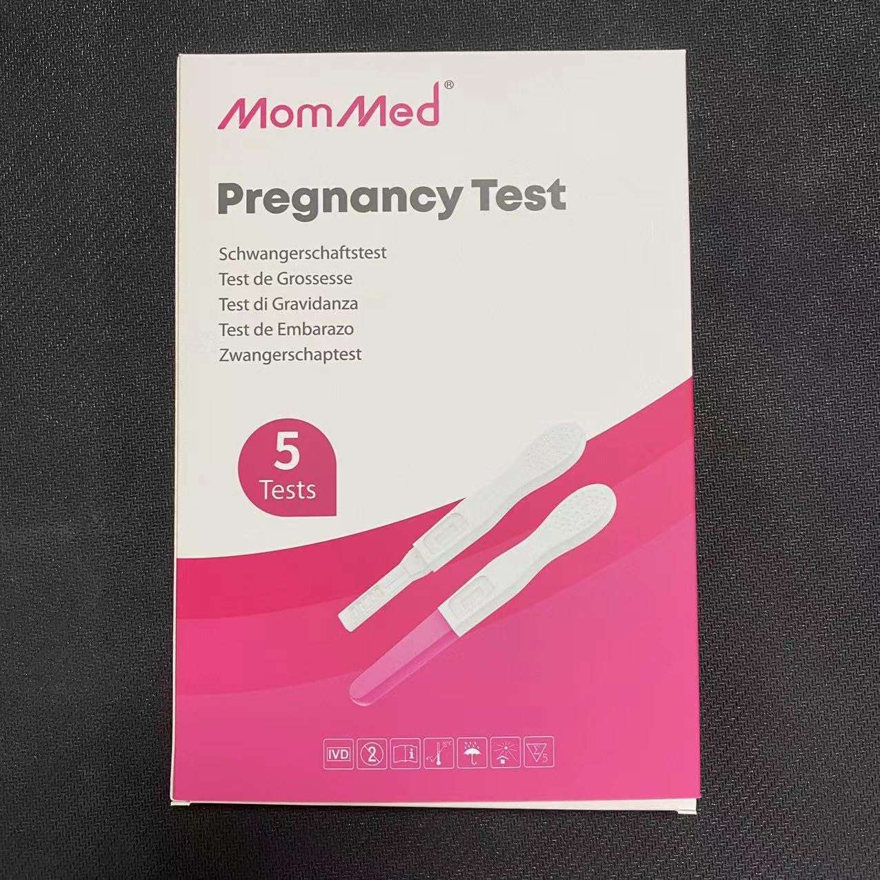 Box of MOMMED HCG midstream pregnancy test 5 pack with white and pink packaging showing two test sticks