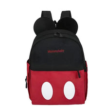 Two-tone baby backpack with black top and red front, mouse-ear hood and white dot design