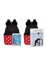 Black and red baby travel backpack with white character print; front opening fits phone or tablet