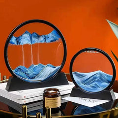 Huitich moving sand art picture with blue sand in circular black frame on display stands