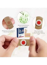 Adhesive foot corn remover pad pressed on skin, circular center window