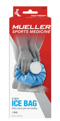 Mueller ice bag 9 inch reusable blue cold therapy bag on ankle in Mueller Sports Medicine packaging