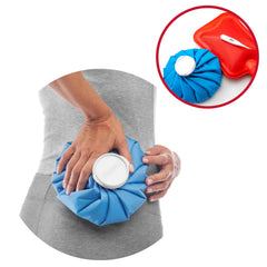 Person applying blue ice pack to lower back for pain relief Mueller ice bag 9 inch with white screw cap and red inset