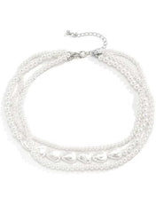 Elegant multi-layer pearl choker necklace with a variety of pearl sizes for a stylish look