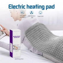 Gray electric heating pad covering the back area with white controller