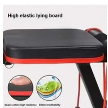 Black padded bench seat with red trim and visible support frame
