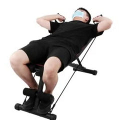 Black multifunctional fitness bench for home gym with resistance bands and leg support