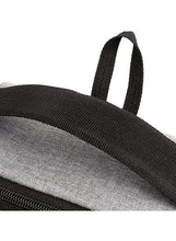 Black webbing shoulder strap on light grey travel backpack