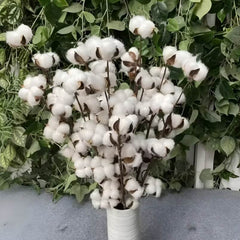 Huitich artificial flowers featuring natural cotton branch decor in a white vase with green leafy background