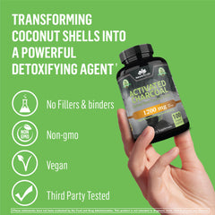 NaturaLife Labs handheld bottle of organic activated charcoal capsules on green background with vegan non GMO third party tested