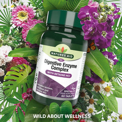 Natures Aid bottle of digestive enzyme complex tablets with betaine HCl 60 tablets amid floral green leaves