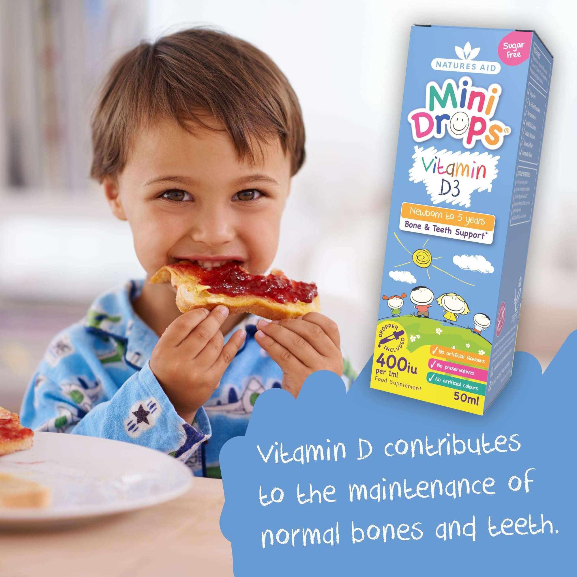 Natures Aid Mini Drops box beside toddler eating toast and jam with vitamin D3 drops for babies