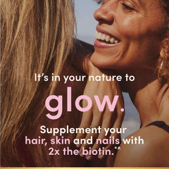Two smiling women outdoors promoting Nature's Bounty hair supplements for glowing hair skin and nails
