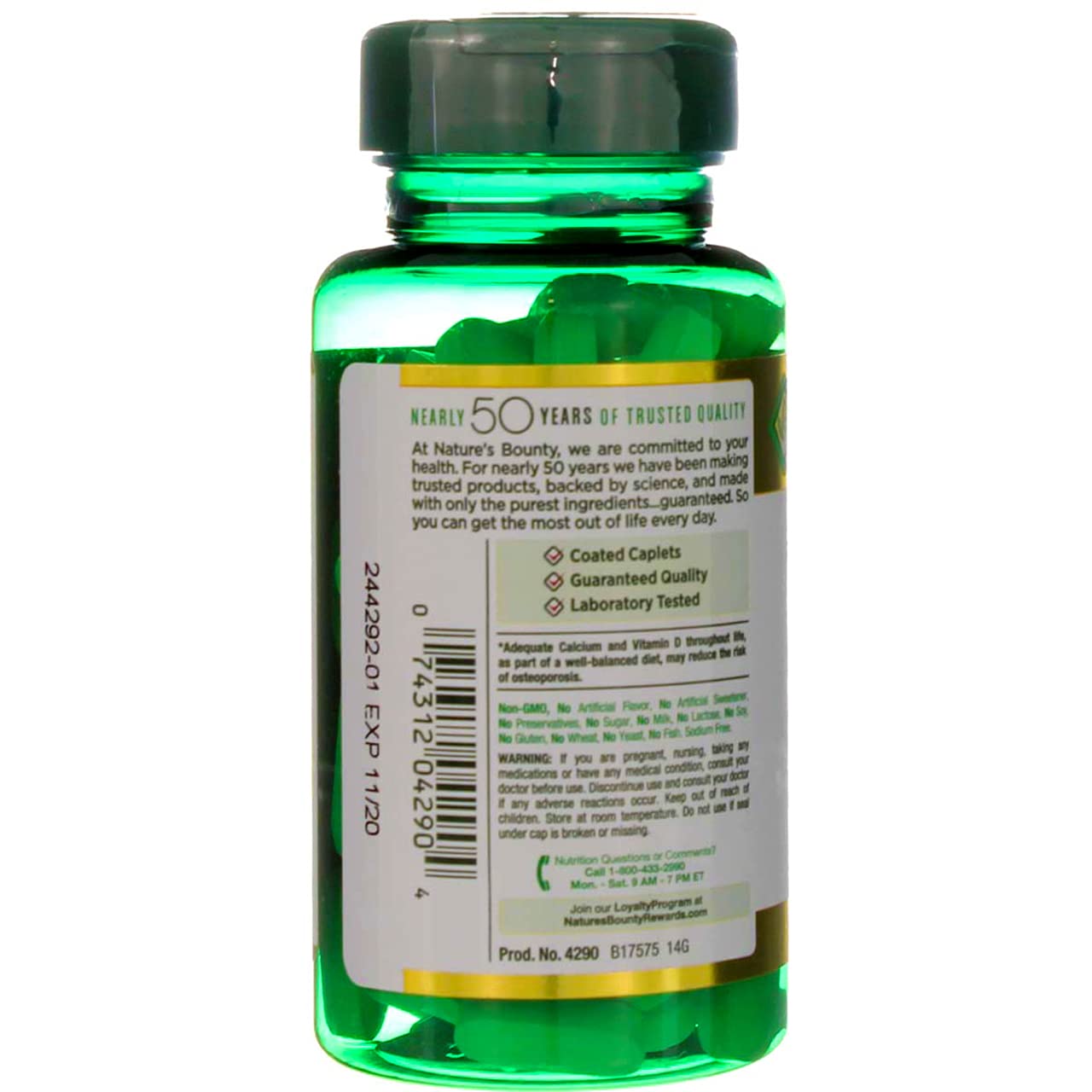 Back view of green supplement bottle showing label and tablets Nature's Bounty calcium magnesium zinc dietary supplement