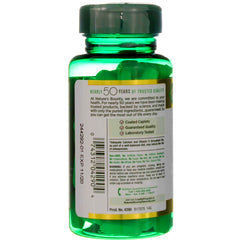 Back view of green supplement bottle showing label and tablets Nature's Bounty calcium magnesium zinc dietary supplement