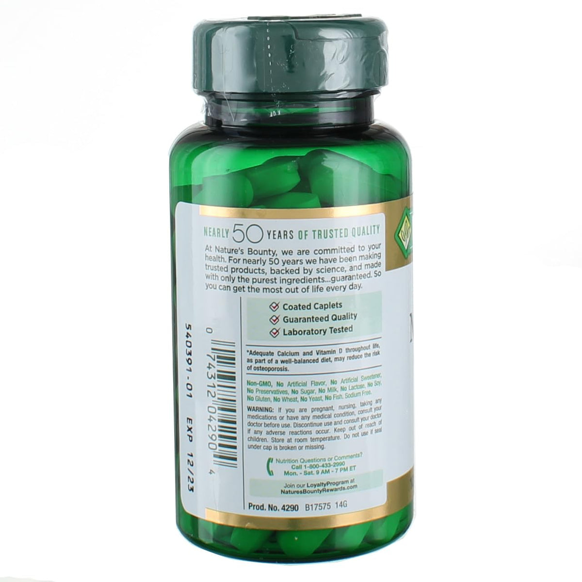 Back view of Nature's Bounty calcium magnesium zinc green supplement bottle showing label and coated cap with tablets inside