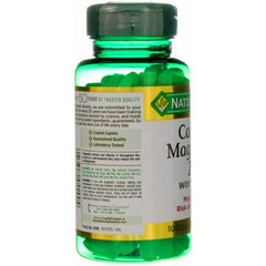 Green Nature's Bounty calcium magnesium zinc supplement bottle with visible tablets and partial label