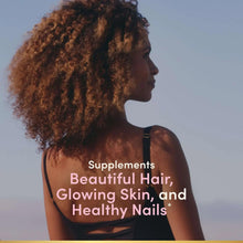 Woman with curly hair in black top; Supplements text overlay