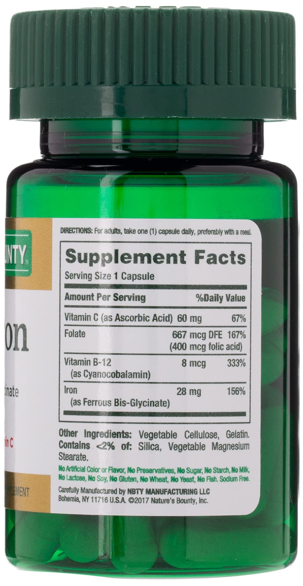 Green Nature's Bounty iron capsules bottle showing supplement facts label and green childproof cap