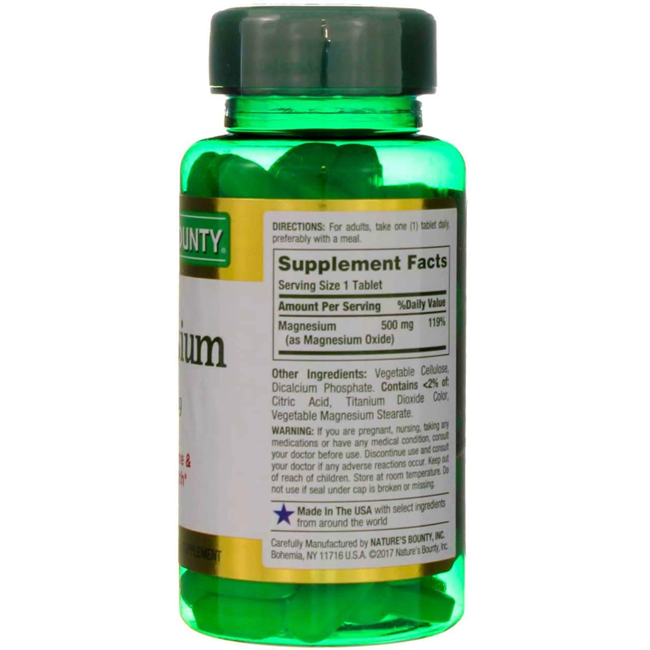 Green bottle of Nature's Bounty magnesium tablets. White label shows Supplement Facts and 500 mg
