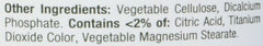 Label close up of Nature's Bounty magnesium tablets showing other ingredients like vegetable cellulose and dicalcium phosphate