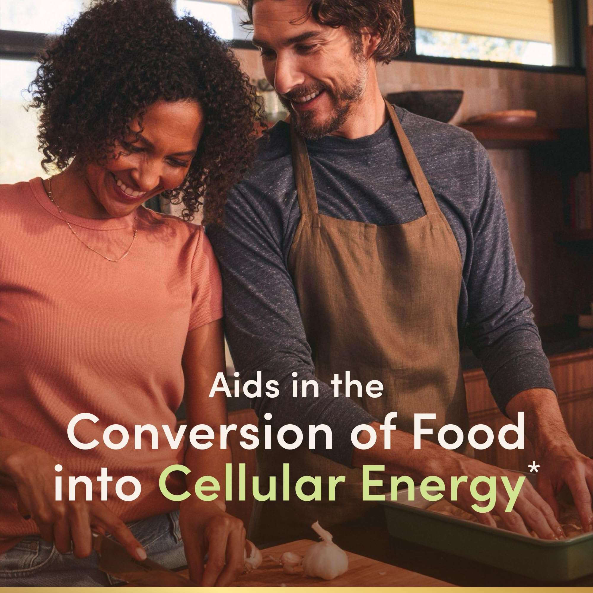 Couple cooking together smiling in kitchen promoting Natures Bounty super B complex with folic acid and vitamin C