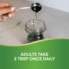 Spoon pouring dark chlorophyll liquid into a jar; 2 tbsp once daily.