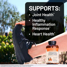 Turmeric curcumin supplement bottle held in hand with Supports label