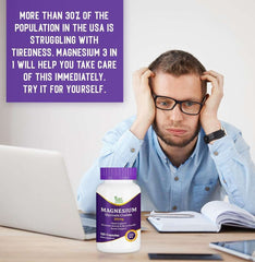 Stressed man at desk with laptop and bottle of magnesium glycinate chelate supplement for fatigue support