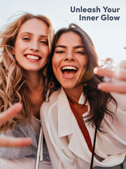 Two smiling women selfie outdoors with sunlight promoting Neocell super collagen powder skin glow