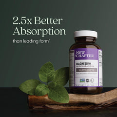 New Chapter magnesium ashwagandha supplement UAE bottle on wood with green leaves and absorption claim