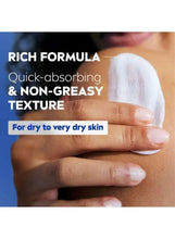 Lotion texture spread on arm and hand with non-greasy, quick-absorbing claim.