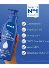 Hand holding NIVEA body lotion rich nourishing 400 ml with benefit icons.