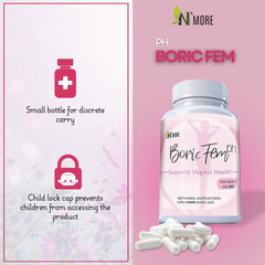 NMore Boric Fem PH bottle with loose white boric acid vaginal suppositories on pink floral background