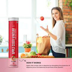 Noble Nature apple cider vinegar effervescent tablets tube beside smiling woman in kitchen with groceries