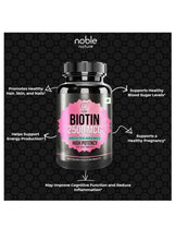 Biotin 2500 mcg supplement bottle on honeycomb backdrop with feature callouts