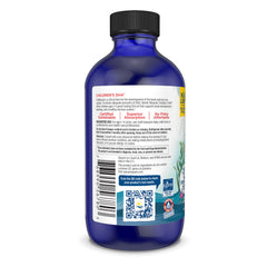 Back view of Nordic Naturals kids omega 3 blue bottle showing label nutrition facts QR code and black cap