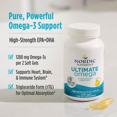 Nordic Naturals Ultimate Omega bottle and two soft gel capsules on counter showcasing benefits Ultimate Omega supplements UAE