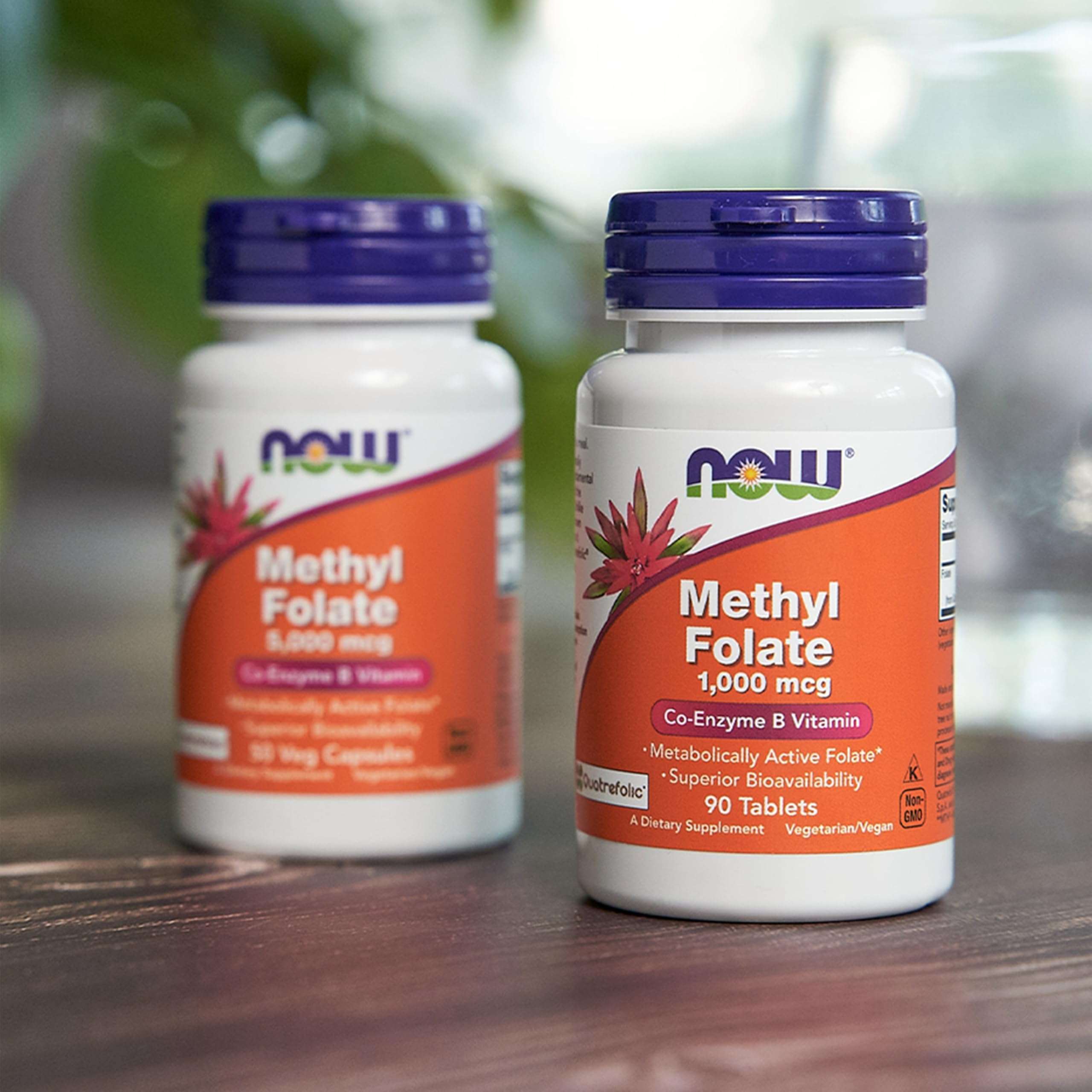 Two white bottles of Now Foods methyl folate supplement 1000 mcg 90 tablets with orange label and purple cap