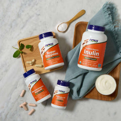 NOW Saccharomyces Boulardii supplement bottle with NOW Inulin and Super Enzymes on marble background