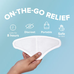 Nua period pain relief heat patches triangular on the go adhesive patch held in hand with icons for 8 hours discreet portable use