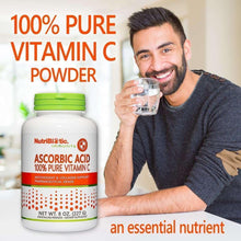 NutriBiotic Ascorbic Acid Vitamin C powder bottle with green cap, shown with a smiling man drinking.