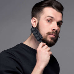 Man using Boao nylon clipper cleaning brush to groom beard with black handle and stiff bristles