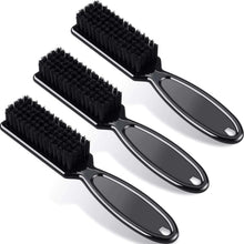 Set of three hair clipper cleaning brushes with black bristles and curved handles